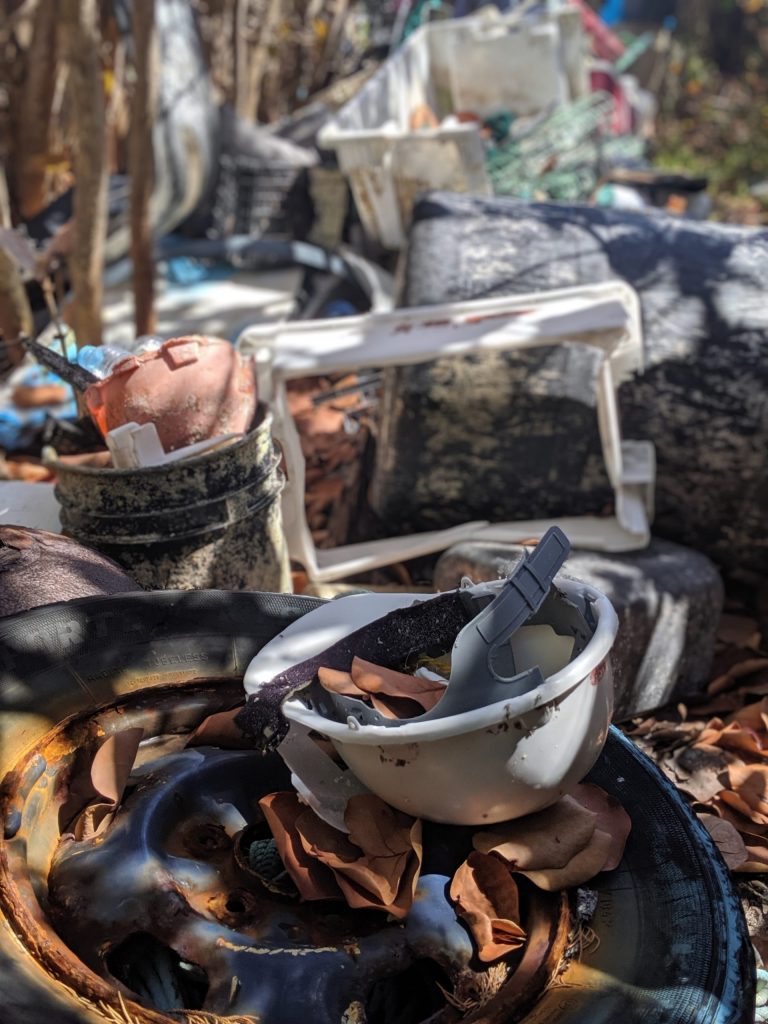 A large pile of collected plastic debris gathered from a short stretch of beach.